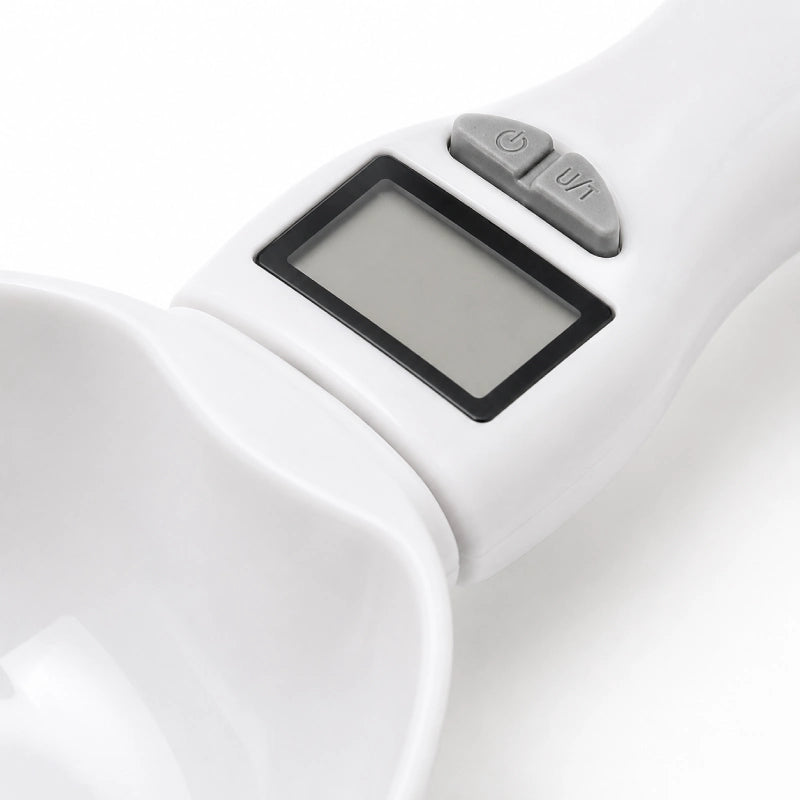 Cuillère chat › Axdose : close-up écran digital et boutons de contrôle - AstuceChat